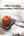 Momax 1-World² mini universal travel GaN charger 70W orange with dual AC outlet and USB ports.