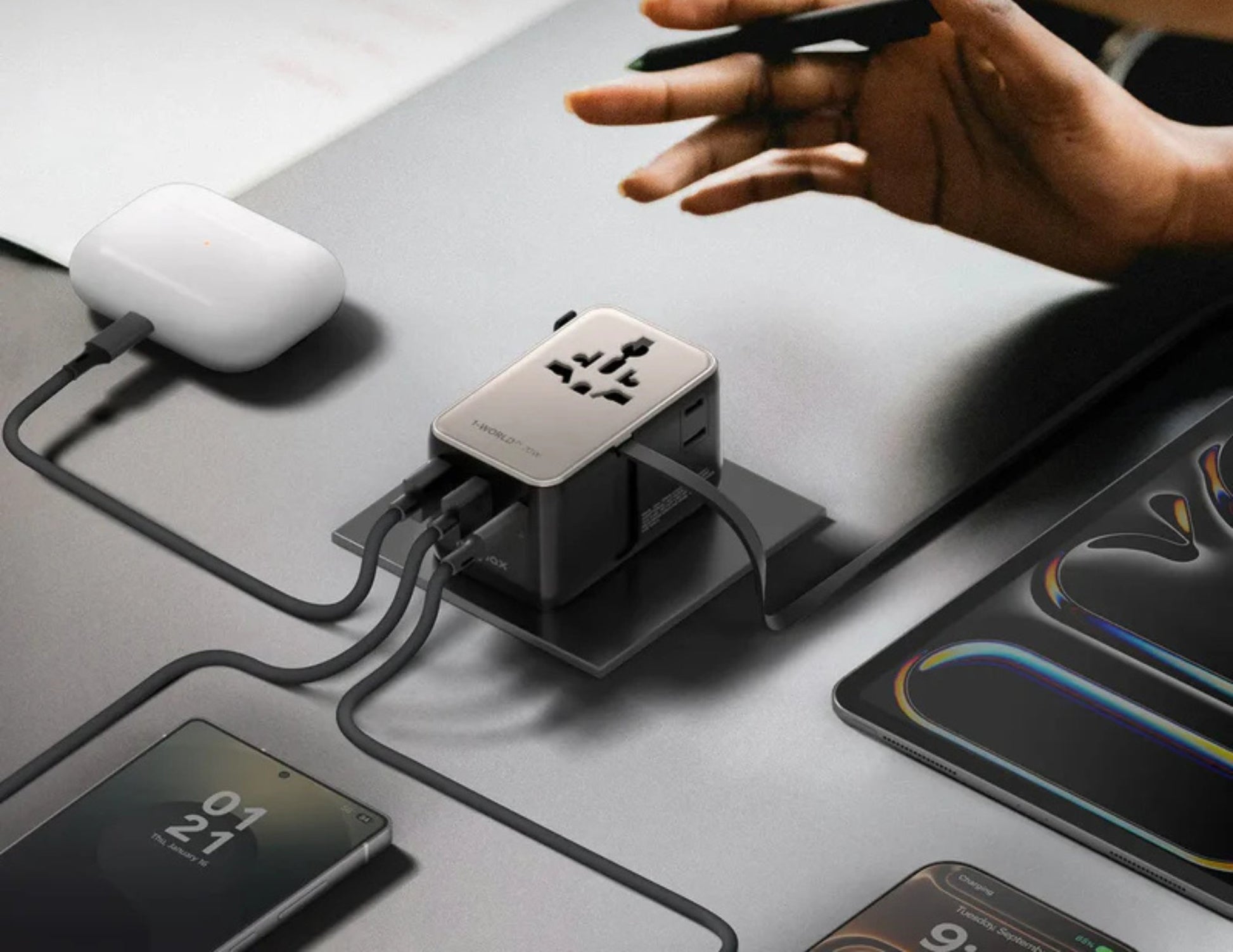 Momax 1-World²⁺ 70W dual AC travel adapter with retractable USB-C cable and universal plugs.