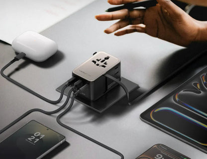 Momax 1-World²⁺ 70W dual AC travel adapter with retractable USB-C cable and universal plugs.