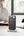Compact Momax US21UKW Power Tower placed on a desk for efficient workspace management.