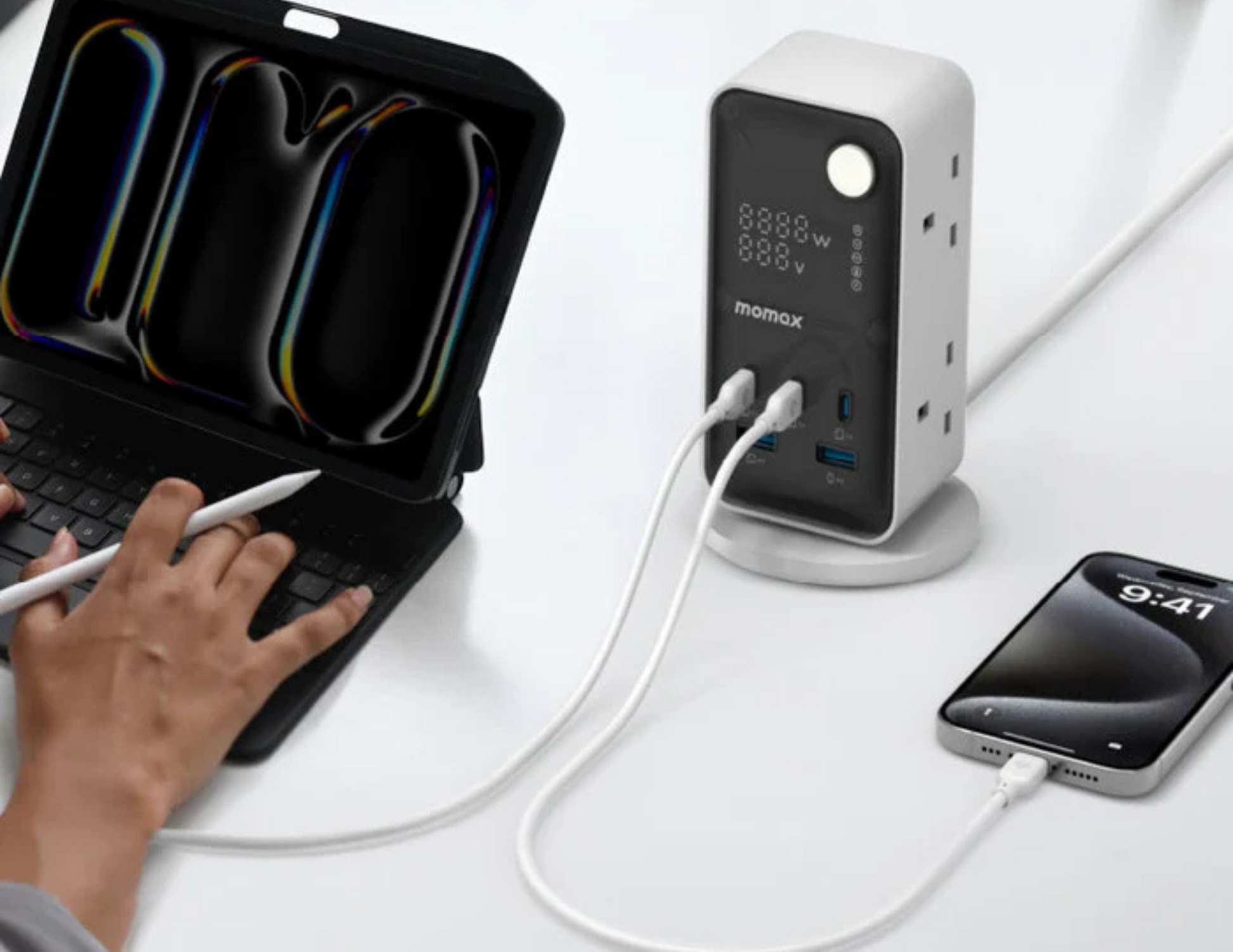 Momax US21UKW Power Tower charging 11 devices simultaneously, including iPads and smartphones.