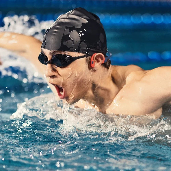 Shokz OpenSwim Pro Red swim-ready bone conduction headphones with IP68 waterproofing and 32GB MP3 storage Qatar