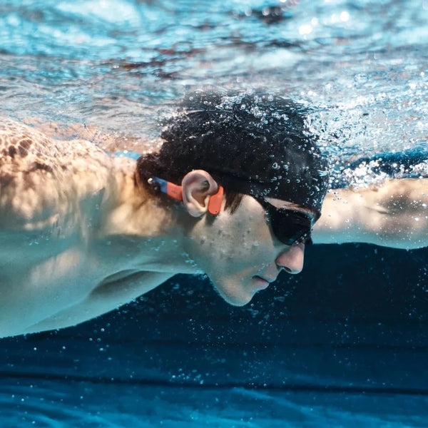 Shokz OpenSwim Pro Red swim-ready bone conduction headphones with IP68 waterproofing and 32GB MP3 storage Qatar