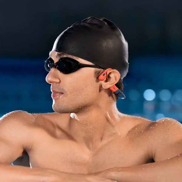 Shokz OpenSwim Pro Red swim-ready bone conduction headphones with IP68 waterproofing and 32GB MP3 storage Qatar