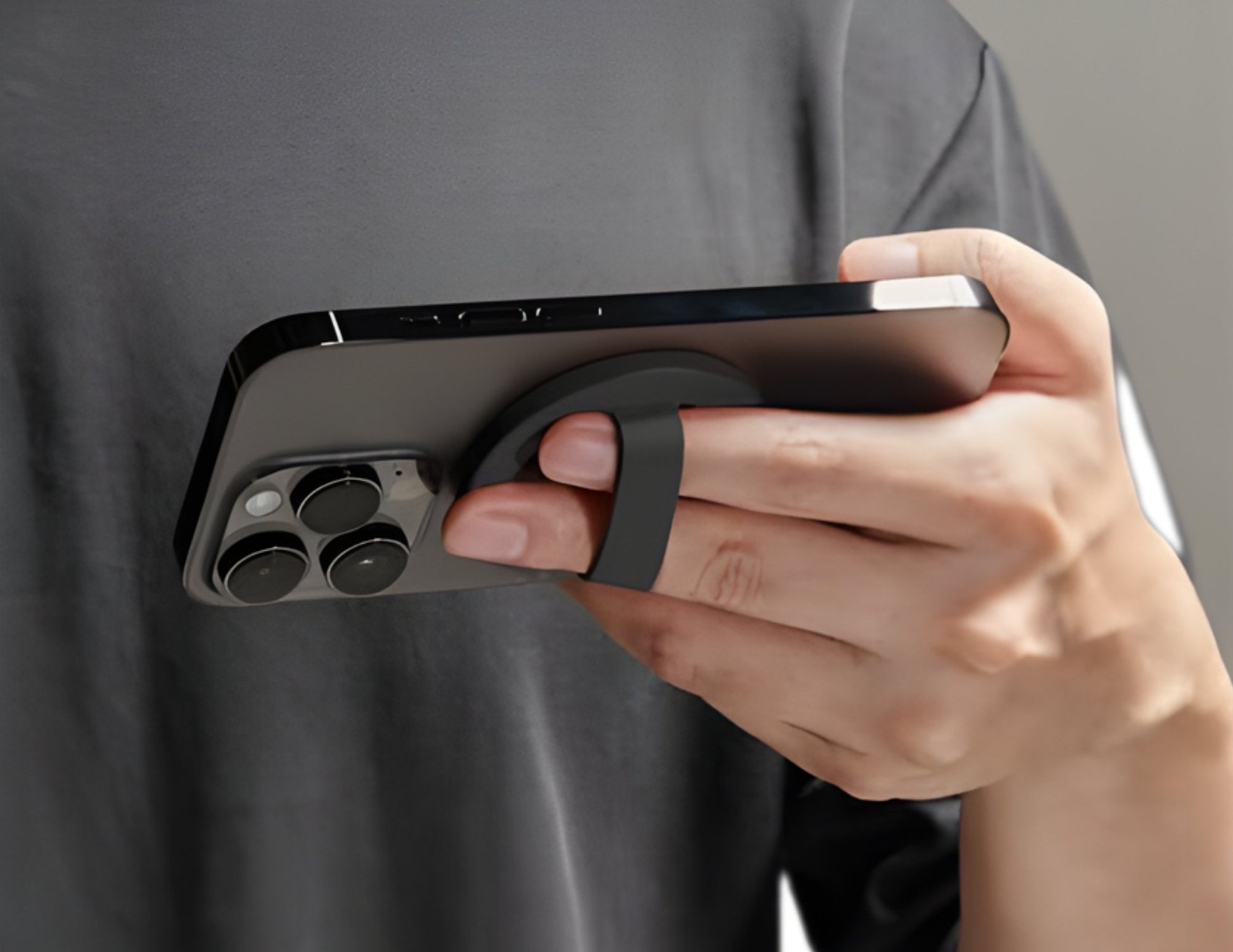 Black silicone magnetic 360-degree phone ring grip holder attached to smartphone Qatar