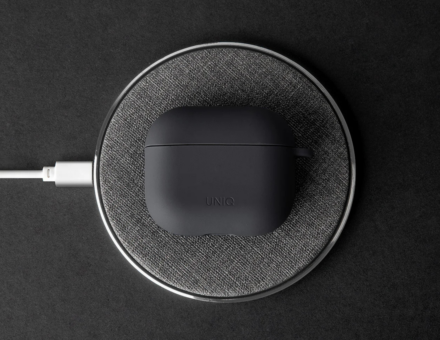 Uniq Nexo case on AirPods (4th Gen) with wireless charging functionality.